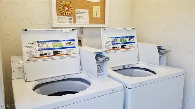 a kitchen with a sink and a washer dryer