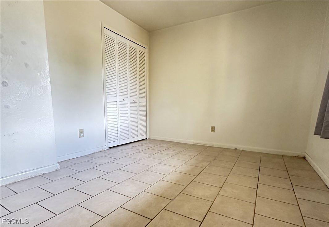 4613 Southwest 8th Place, Unit 4 Cape Coral, FL 33914 - Photo 10 of 16 a view of an empty room