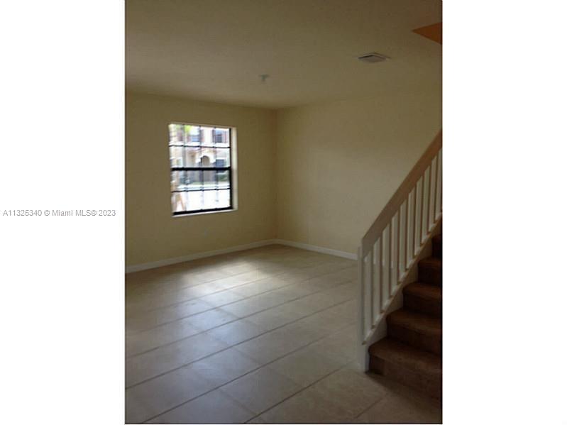 8946 West 35th Way Hialeah, FL 33018 - Photo 17 of 25 a view of an empty room with a window