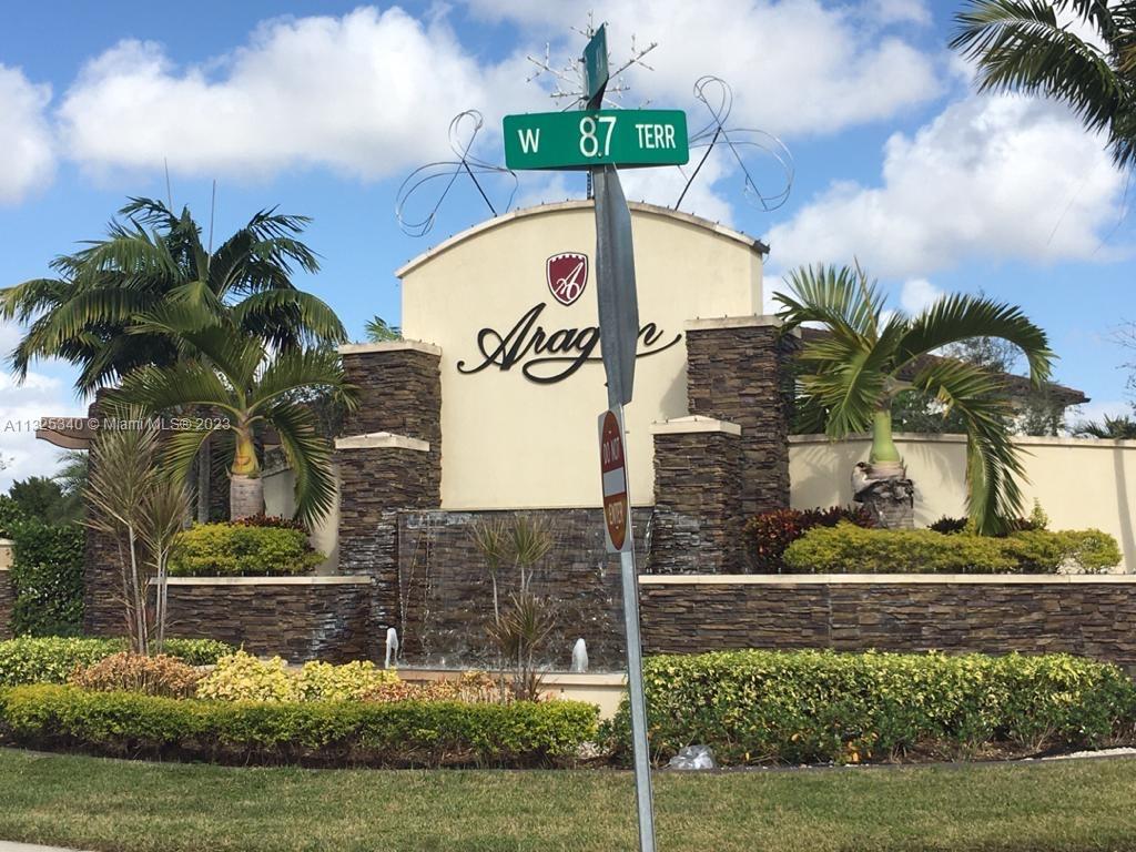 8946 West 35th Way Hialeah, FL 33018 - Photo 2 of 25 a front view of a house with a yard