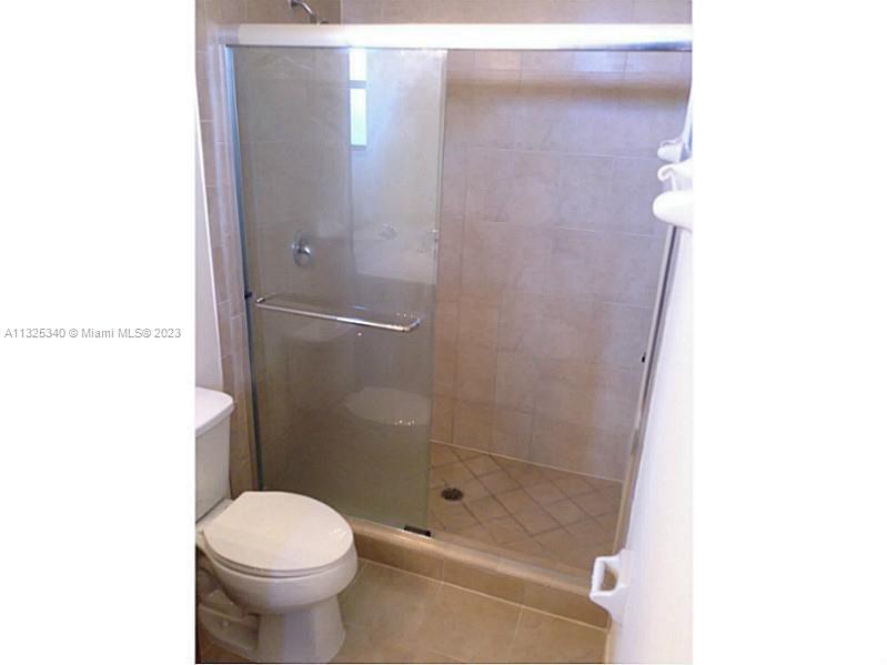 8946 West 35th Way Hialeah, FL 33018 - Photo 23 of 25 a bathroom with a shower and a toilet