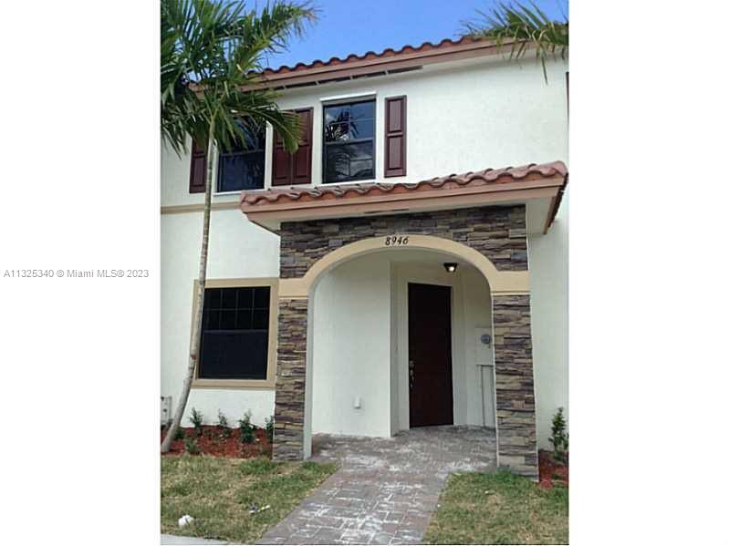 8946 West 35th Way Hialeah, FL 33018 - Photo 3 of 25 a view of a house with large windows