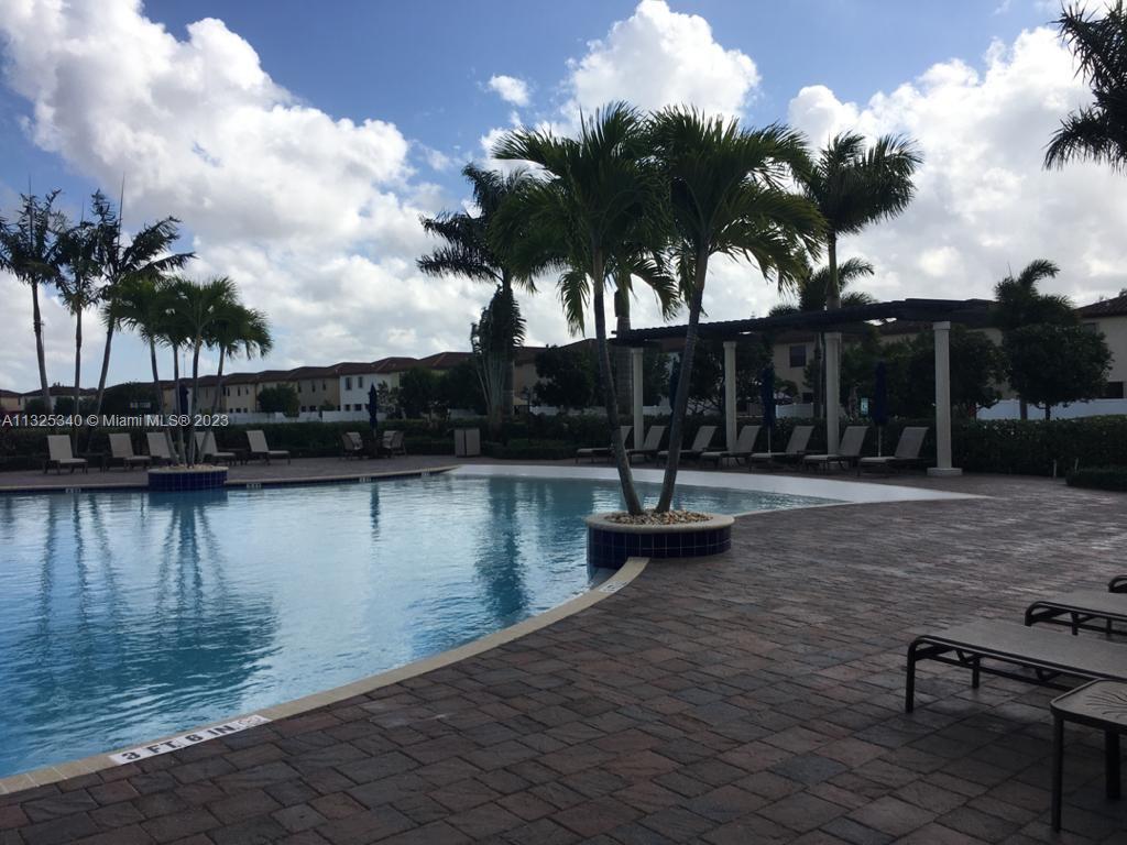 8946 West 35th Way Hialeah, FL 33018 - Photo 7 of 25 a swimming pool with outdoor seating