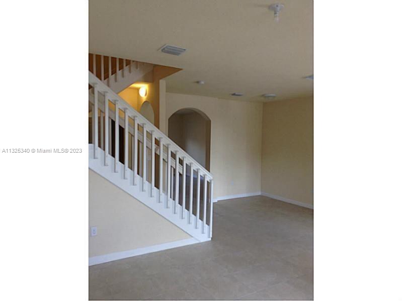 8946 West 35th Way Hialeah, FL 33018 - Photo 10 of 25 a view of a hallway with staircase