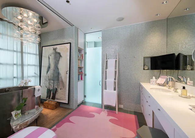 a bathroom with a double vanity sink mirror and shower