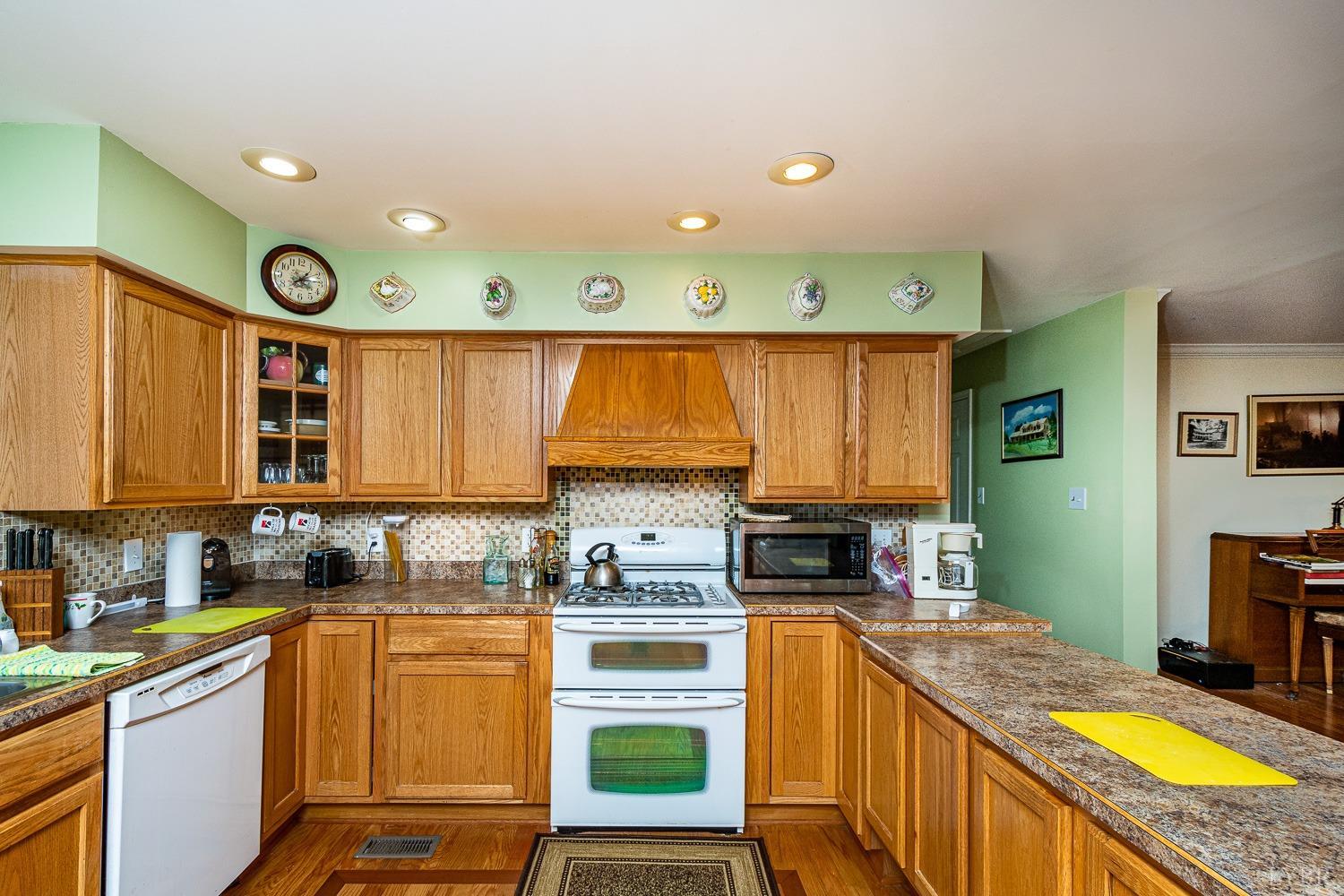 552 Pendleton Drive Amherst, VA 24521 - Photo 12 of 58 a kitchen with stainless steel appliances granite countertop a stove a sink and a refrigerator