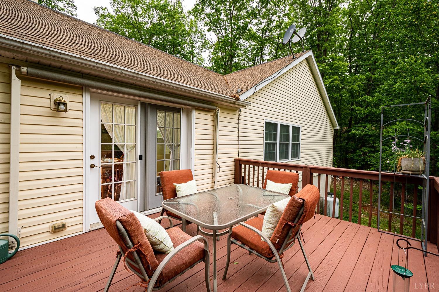 552 Pendleton Drive Amherst, VA 24521 - Photo 22 of 58 a view of a patio with a table and chairs