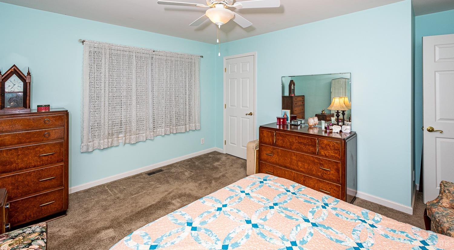 552 Pendleton Drive Amherst, VA 24521 - Photo 37 of 58 a bedroom with a bed and a dresser in it