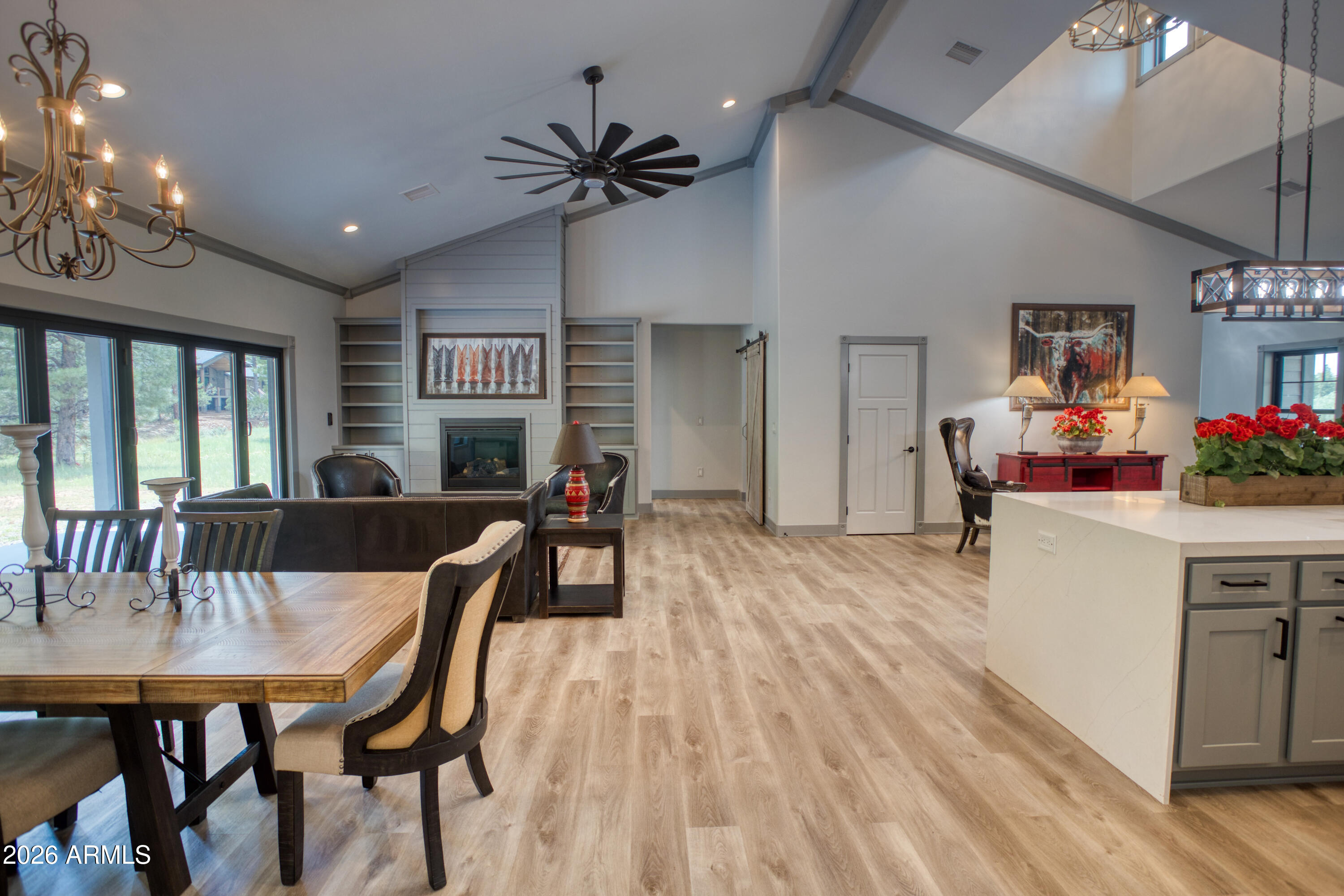 2281 West Edgewater Show Low, AZ 85901 - Photo 14 of 46 a view of a dining room with furniture and wooden floor