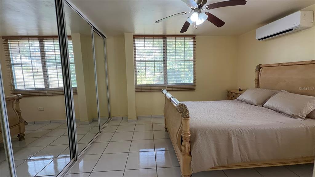 1 St Rio Grande, Unit B6 Rio Grande, PR 00745 - Photo 45 of 47 a bedroom with a bed and a window