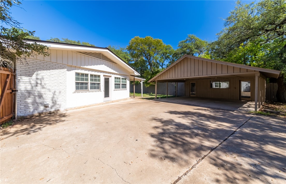11801 Bell Avenue Austin, TX 78759 - Photo 25 of 31 a view of a house with a yard and garage