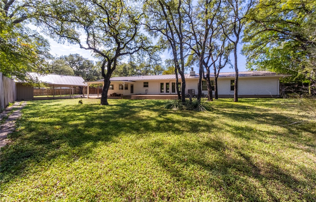 11801 Bell Avenue Austin, TX 78759 - Photo 29 of 31 a backyard of a house with table and chairs
