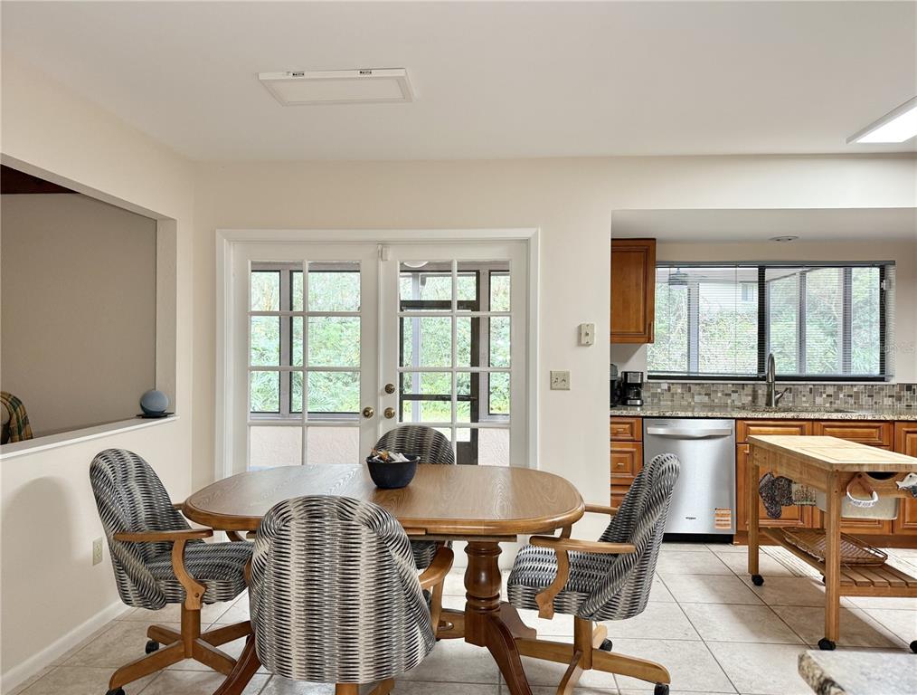 6101 Soaring Avenue Temple Terrace, FL 33617 - Photo 15 of 53 a view of a dining room with furniture window and outside view