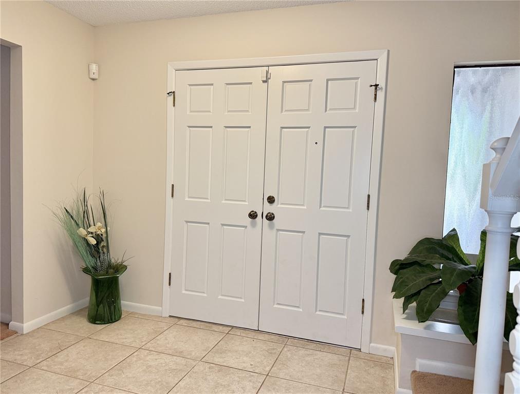 6101 Soaring Avenue Temple Terrace, FL 33617 - Photo 2 of 53 a view of entryway with cabinet