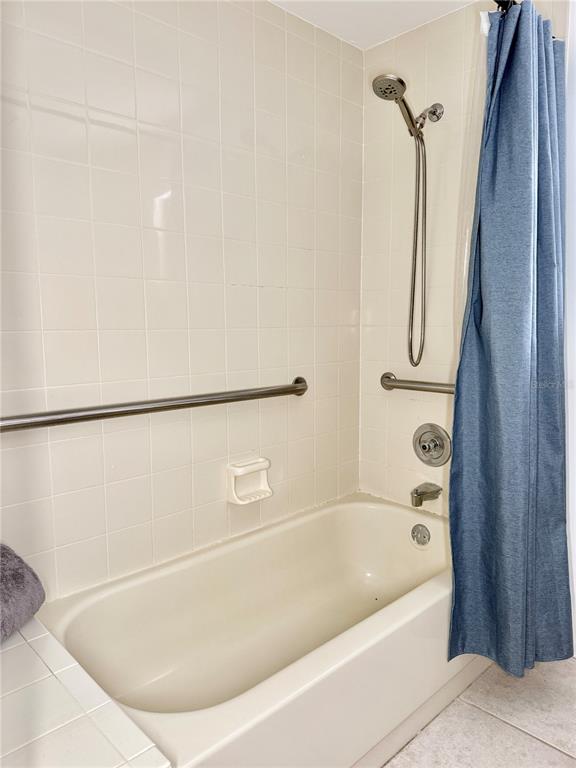 6101 Soaring Avenue Temple Terrace, FL 33617 - Photo 25 of 53 a bathroom with a bathtub and a shower