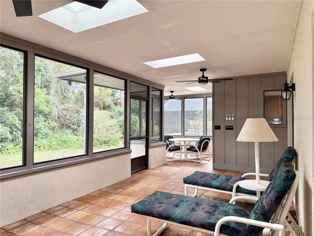 6101 Soaring Avenue Temple Terrace, FL 33617 - Photo 35 of 53 a living room with furniture and a large window