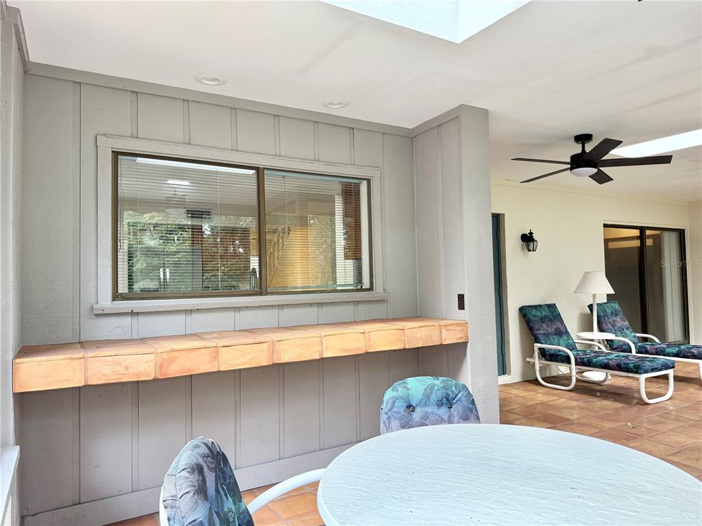 6101 Soaring Avenue Temple Terrace, FL 33617 - Photo 37 of 53 a dining room with a window and gym equipment