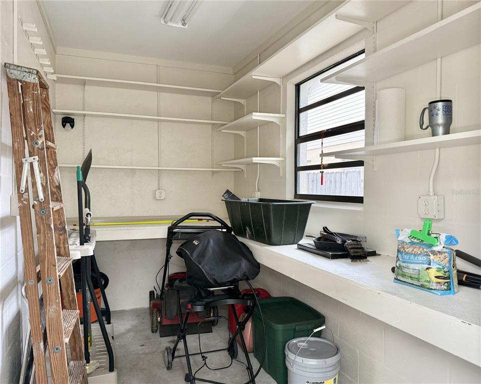 6101 Soaring Avenue Temple Terrace, FL 33617 - Photo 41 of 53 a view of a workspace with furniture and gym equipment