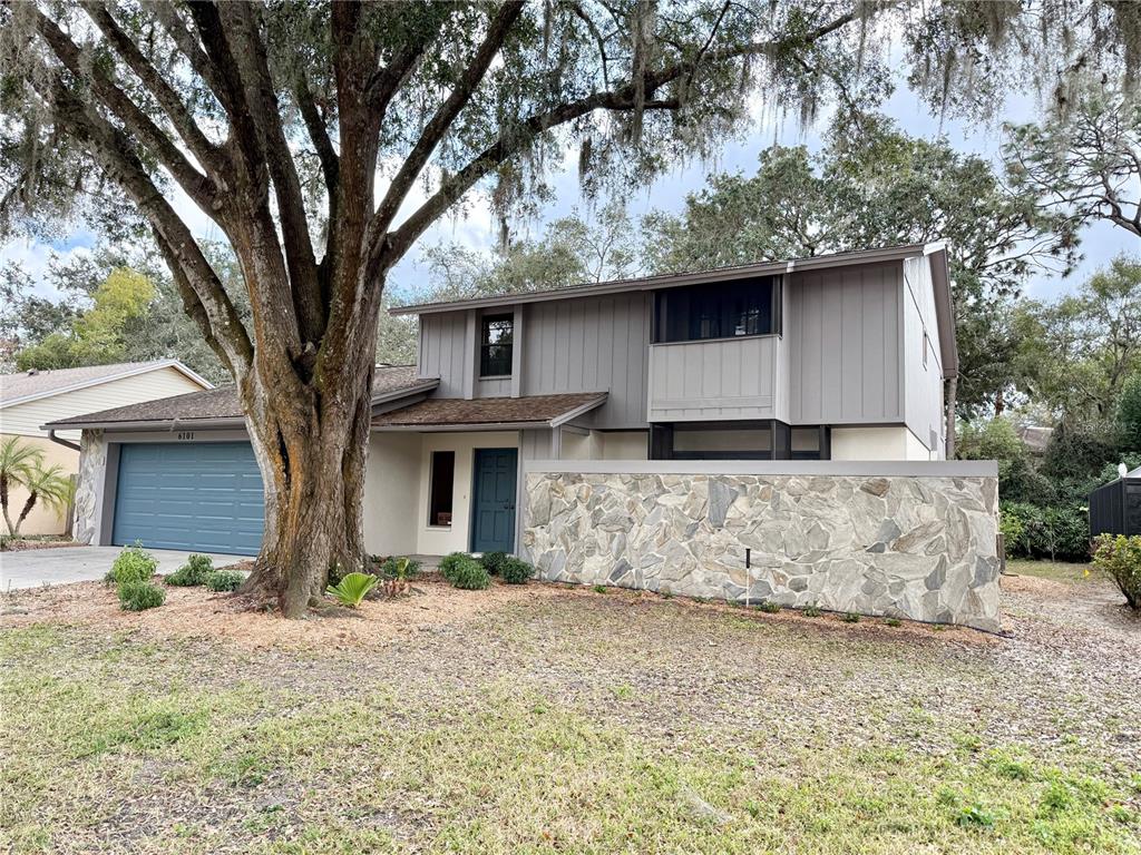 6101 Soaring Avenue Temple Terrace, FL 33617 - Photo 46 of 53 a front view of a house with garden