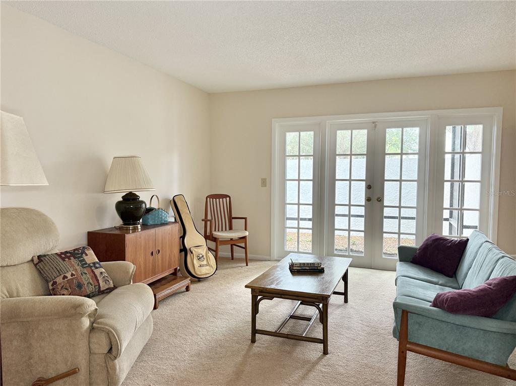 6101 Soaring Avenue Temple Terrace, FL 33617 - Photo 6 of 53 a living room with furniture and a large window