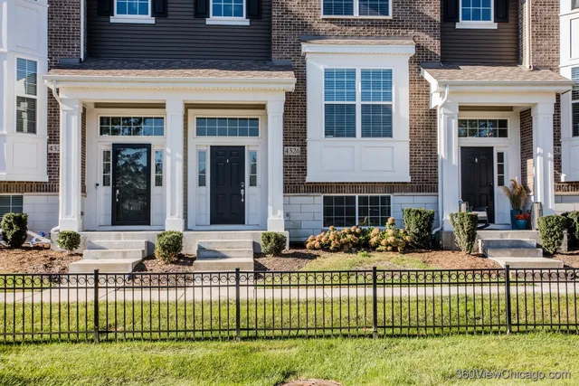a front view of a house with a swimming pool