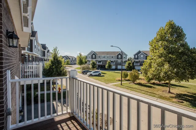 a view of a balcony and yard