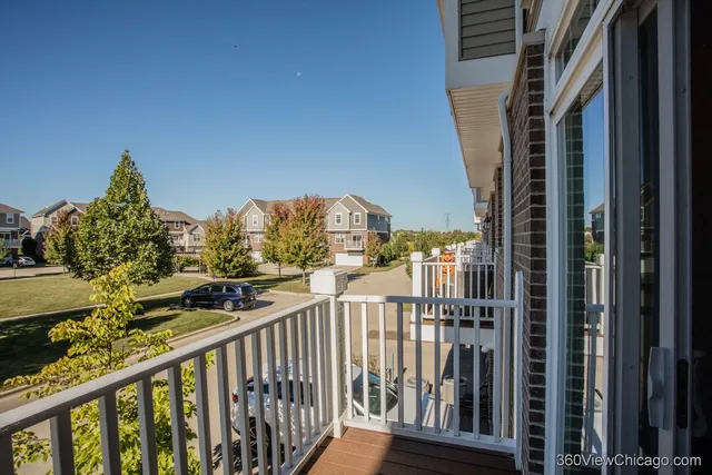 a view of balcony with furniture