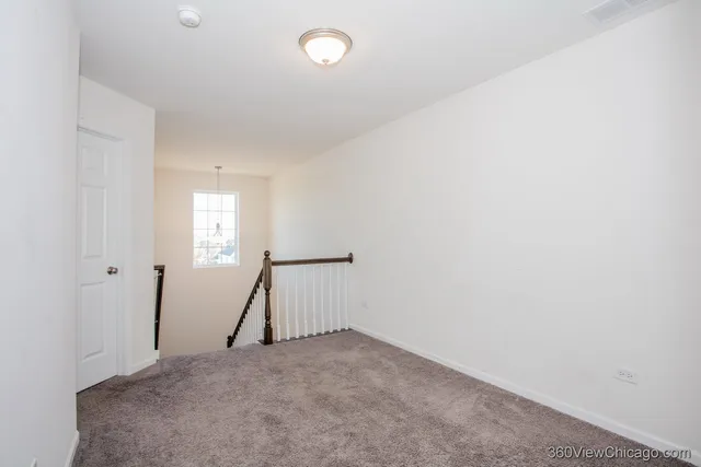 a view of house with yard and large trees