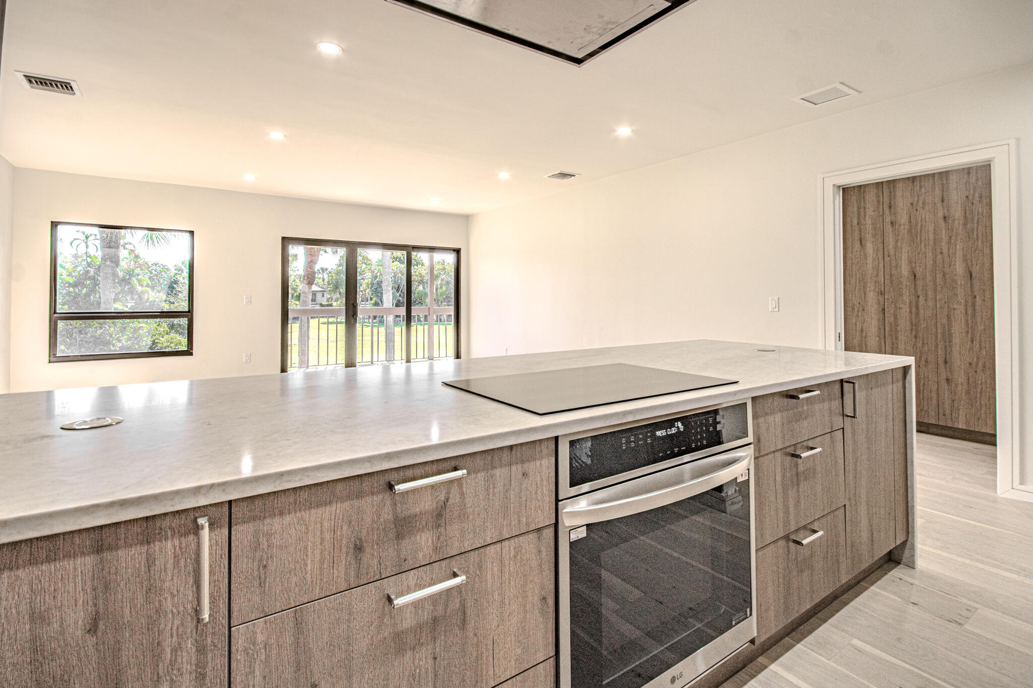 13334 Polo Club Road, Unit 348 Wellington, FL 33414 - Photo 14 of 43 an oven with stainless steel appliances granite countertop a stove and a sink