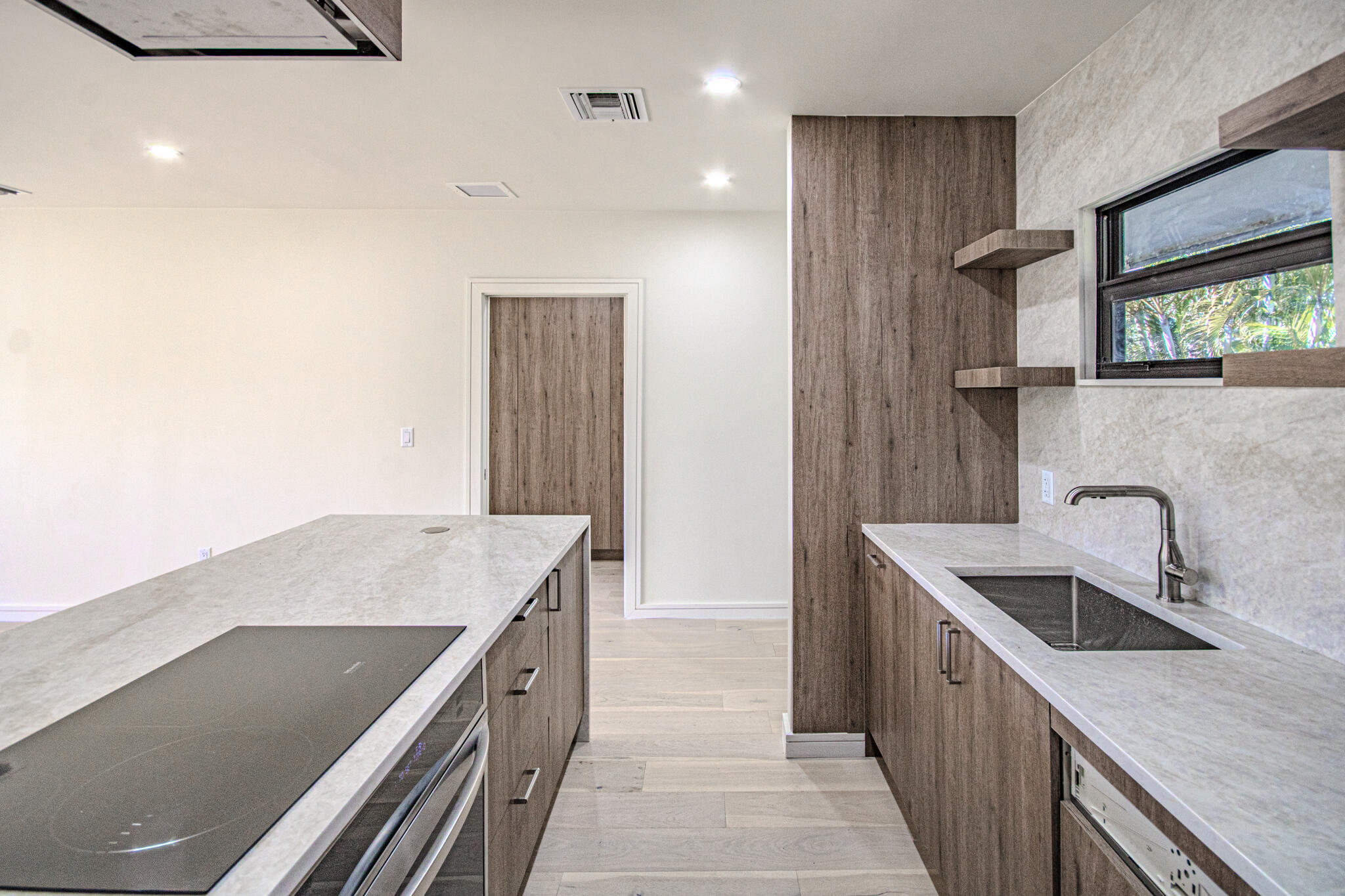13334 Polo Club Road, Unit 348 Wellington, FL 33414 - Photo 15 of 43 a kitchen that has a sink and a stove in it