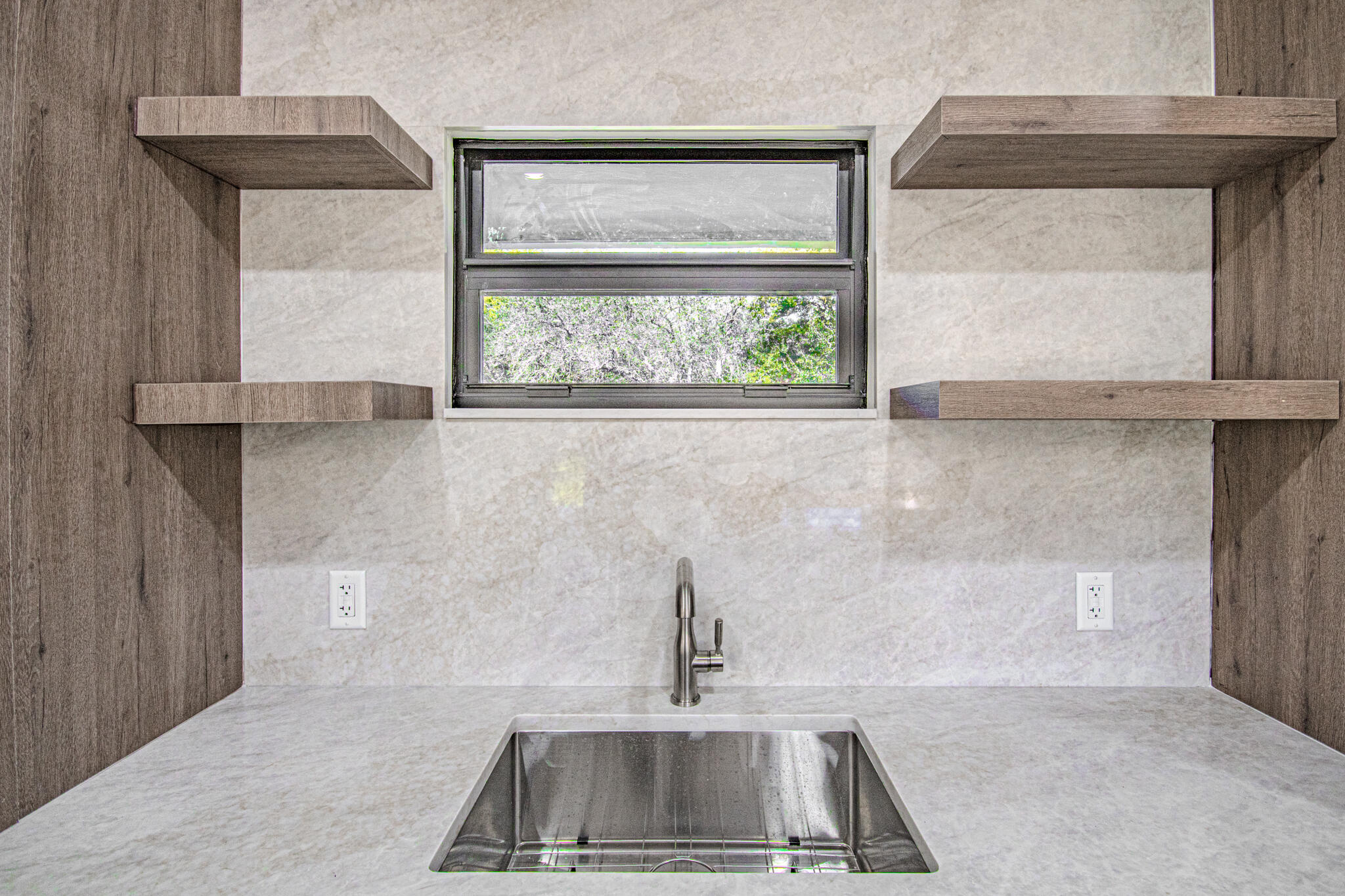 13334 Polo Club Road, Unit 348 Wellington, FL 33414 - Photo 16 of 43 a kitchen with a sink a window and cabinets