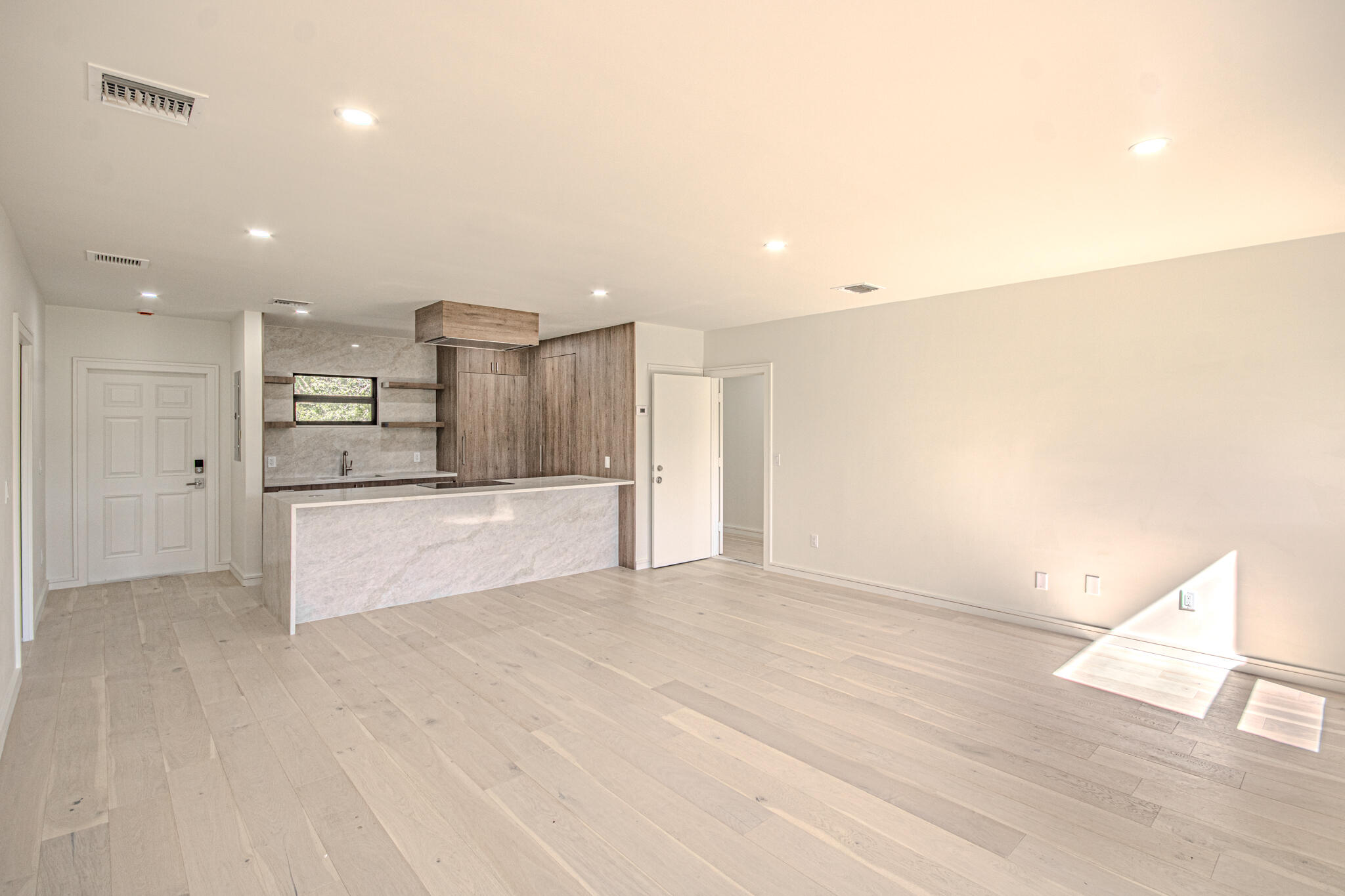 13334 Polo Club Road, Unit 348 Wellington, FL 33414 - Photo 8 of 43 a view of kitchen with refrigerator and wooden floor