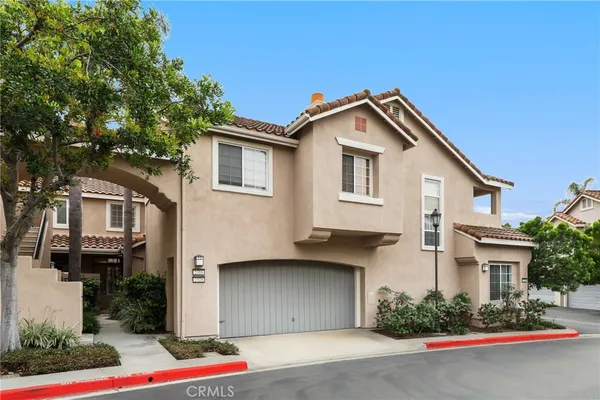 a front view of a house with garage