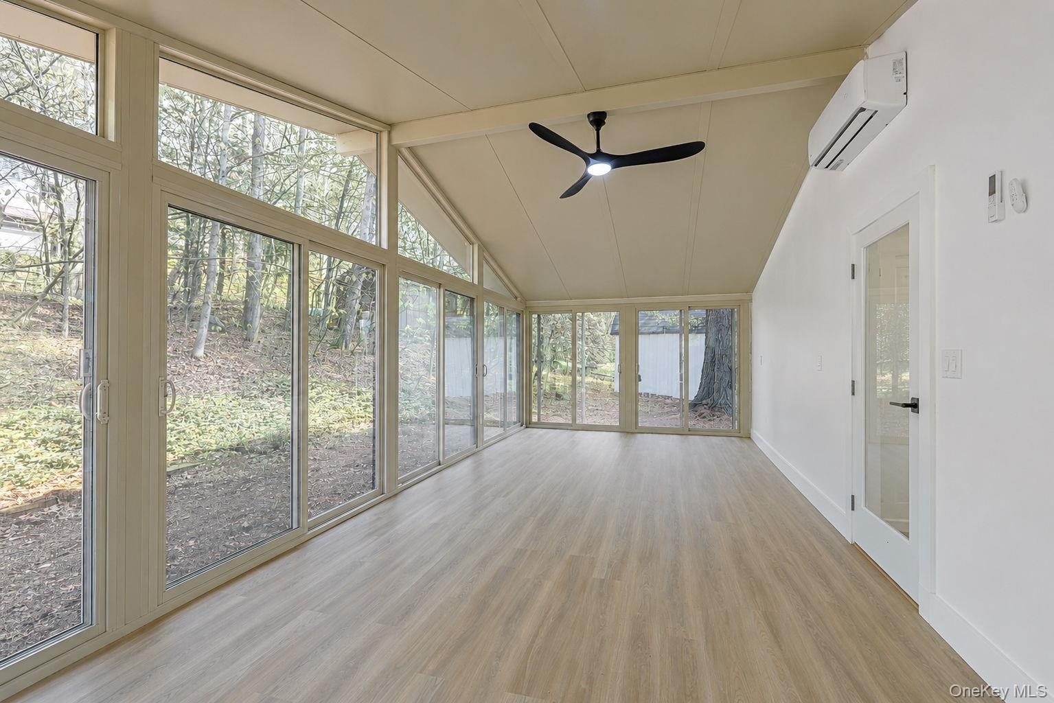 25 Overlook Road Woodbourne, NY 12788 - Photo 15 of 22 a view of an empty room with wooden floor and a window