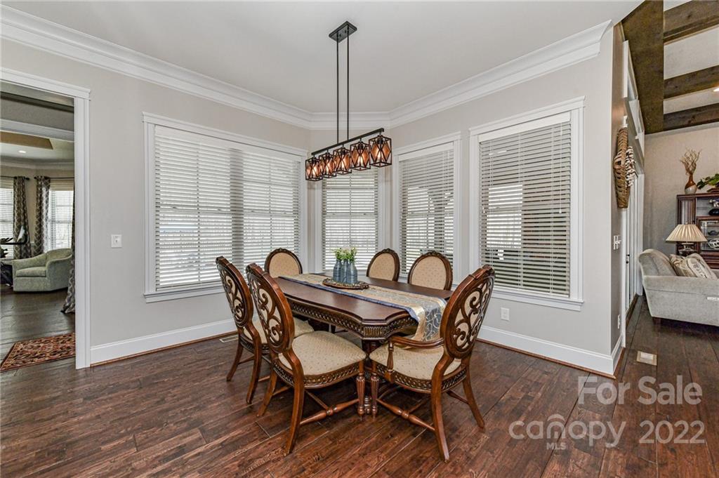 9625 Kerr Road Indian Trail, NC 28079 - Photo 14 of 48 a view of a dining room with furniture window and wooden floor