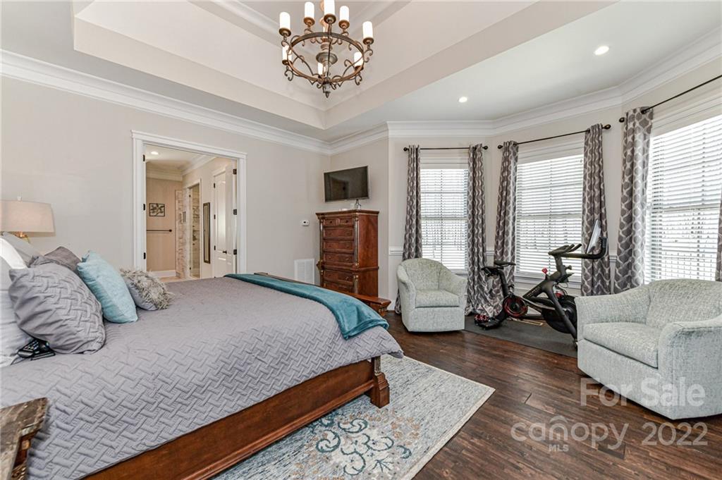 9625 Kerr Road Indian Trail, NC 28079 - Photo 19 of 48 a bedroom with a large bed and a couch