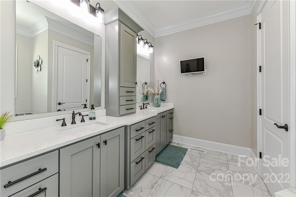 9625 Kerr Road Indian Trail, NC 28079 - Photo 21 of 48 a spacious bathroom with a double vanity sink mirror and