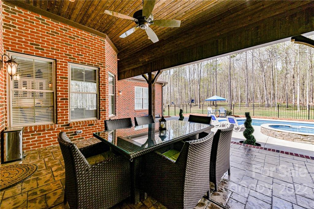 9625 Kerr Road Indian Trail, NC 28079 - Photo 39 of 48 a dining room with furniture and large windows