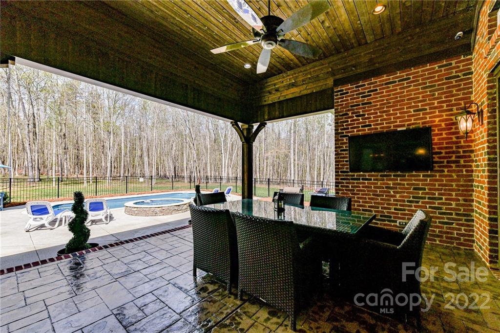 9625 Kerr Road Indian Trail, NC 28079 - Photo 40 of 48 a living room with furniture and a flat screen tv