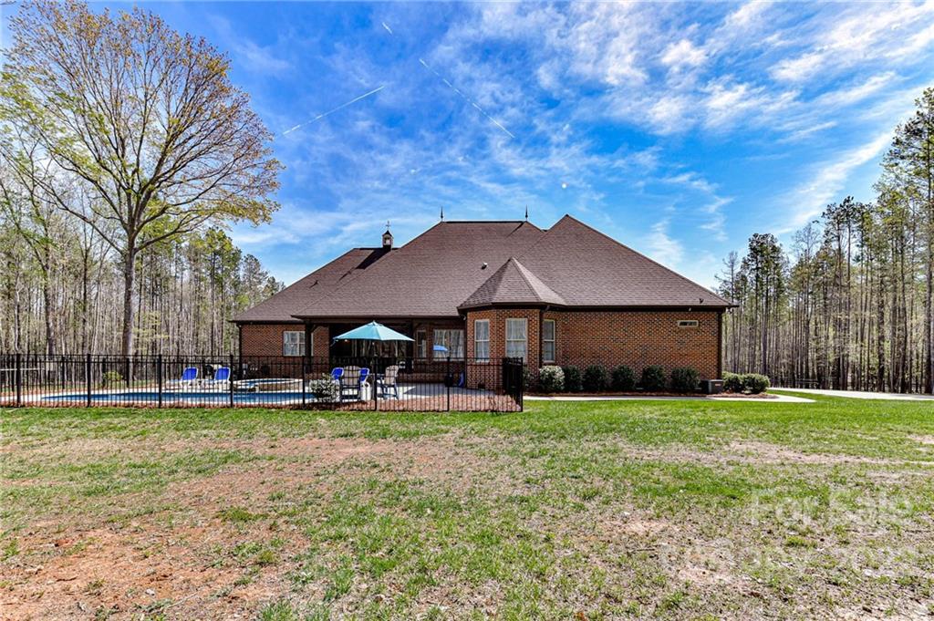 9625 Kerr Road Indian Trail, NC 28079 - Photo 46 of 48 a view of a house with a yard and sitting area