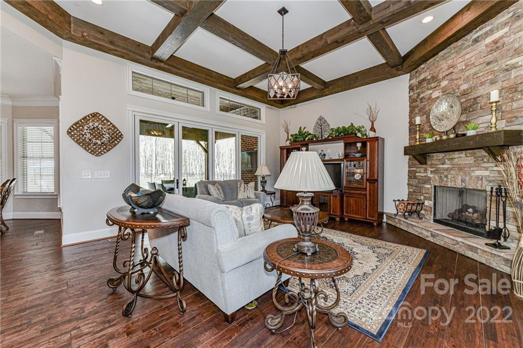 9625 Kerr Road Indian Trail, NC 28079 - Photo 6 of 48 a living room with furniture a rug and a fireplace