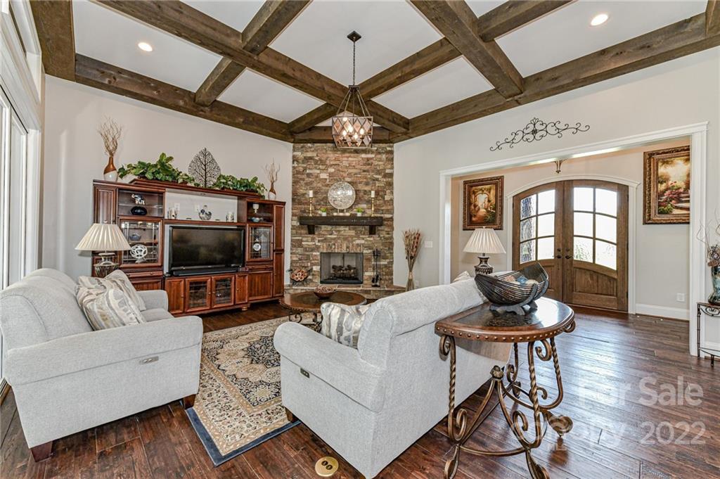 9625 Kerr Road Indian Trail, NC 28079 - Photo 7 of 48 a living room with fireplace furniture and a flat screen tv