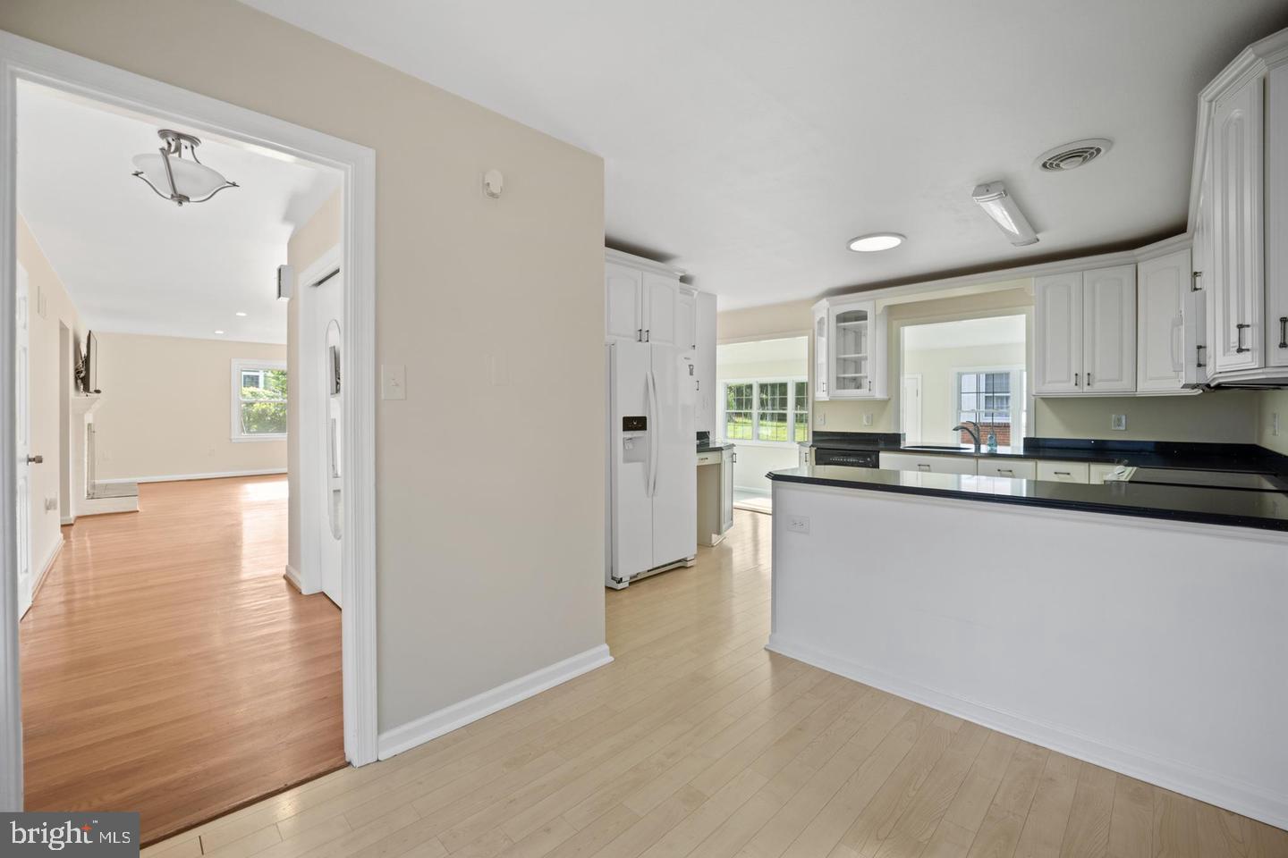 705 Halstead Road Wilmington, DE 19803 - Photo 11 of 31 a large white kitchen with stainless steel appliances granite countertop a refrigerator and a stove