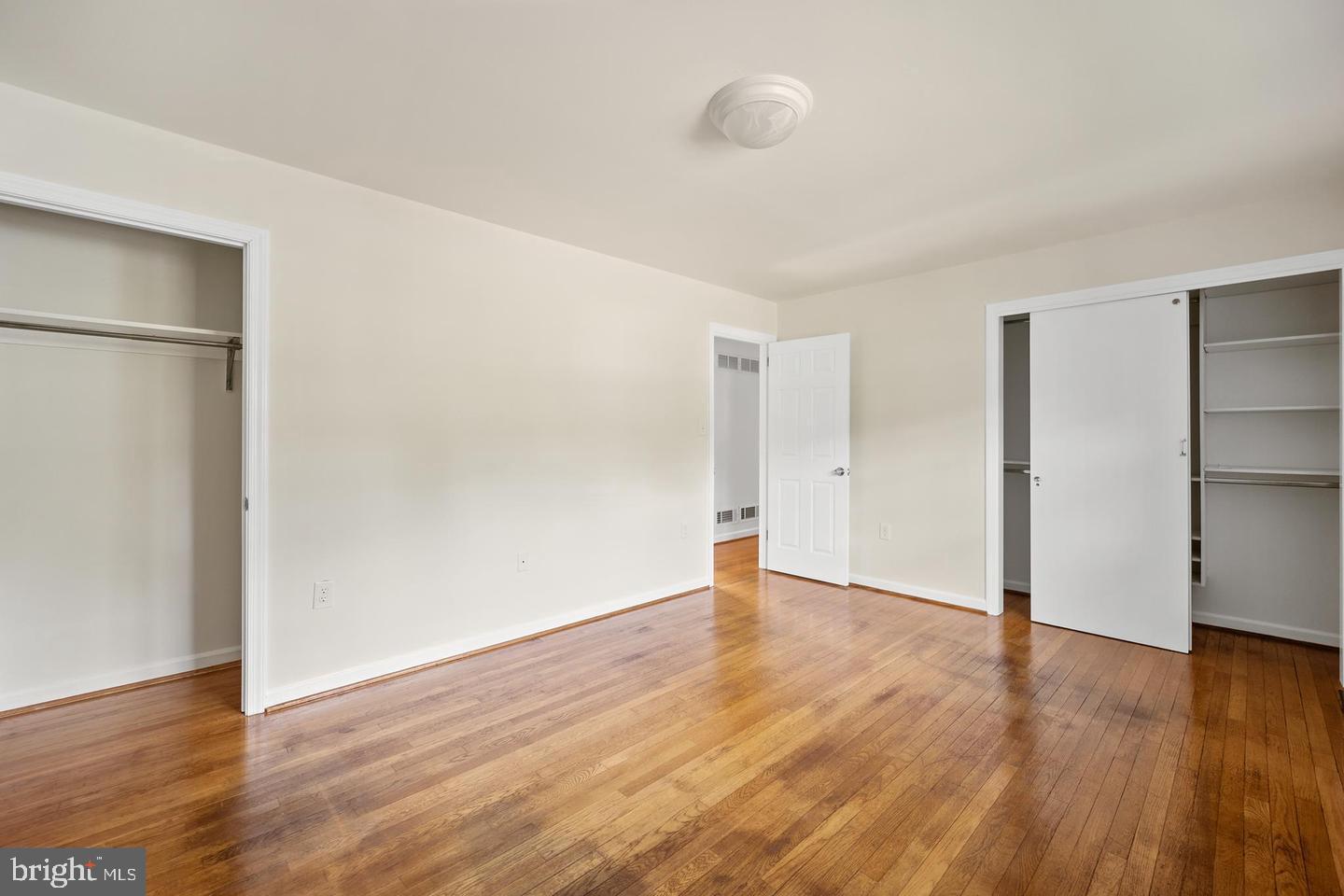 705 Halstead Road Wilmington, DE 19803 - Photo 17 of 31 a view of an empty room with wooden floor and a window