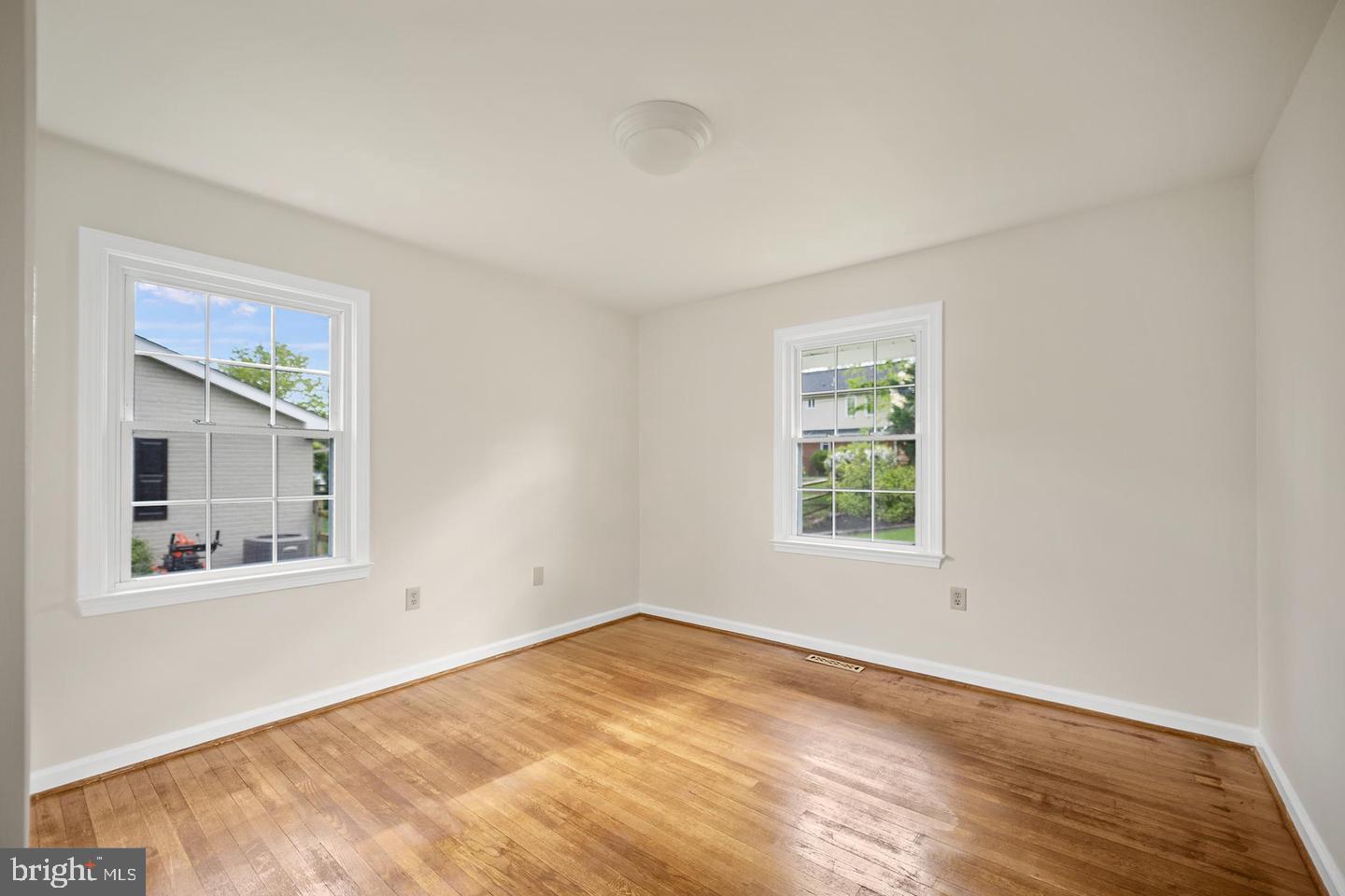 705 Halstead Road Wilmington, DE 19803 - Photo 19 of 31 a view of empty room with window and wooden floor