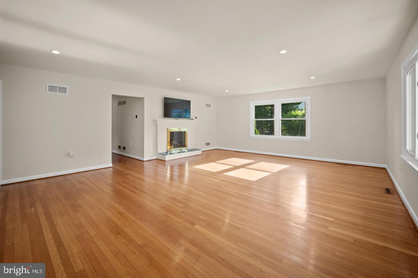705 Halstead Road Wilmington, DE 19803 - Photo 5 of 31 a view of empty room with wooden floor and windows