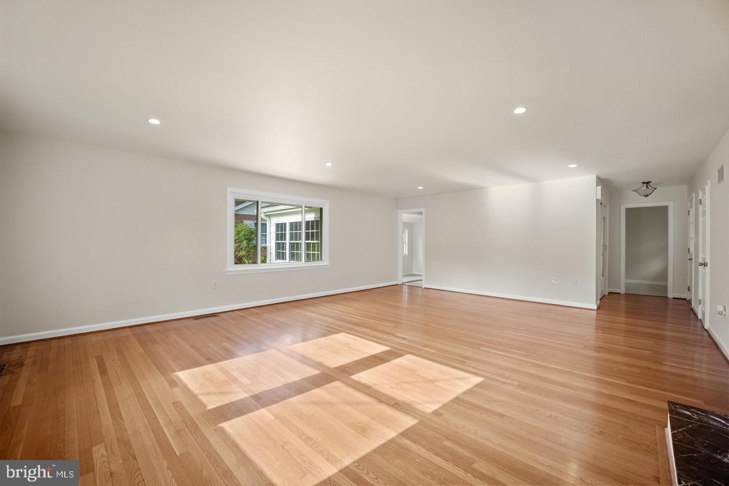 705 Halstead Road Wilmington, DE 19803 - Photo 7 of 31 a view of an empty room with wooden floor and a window