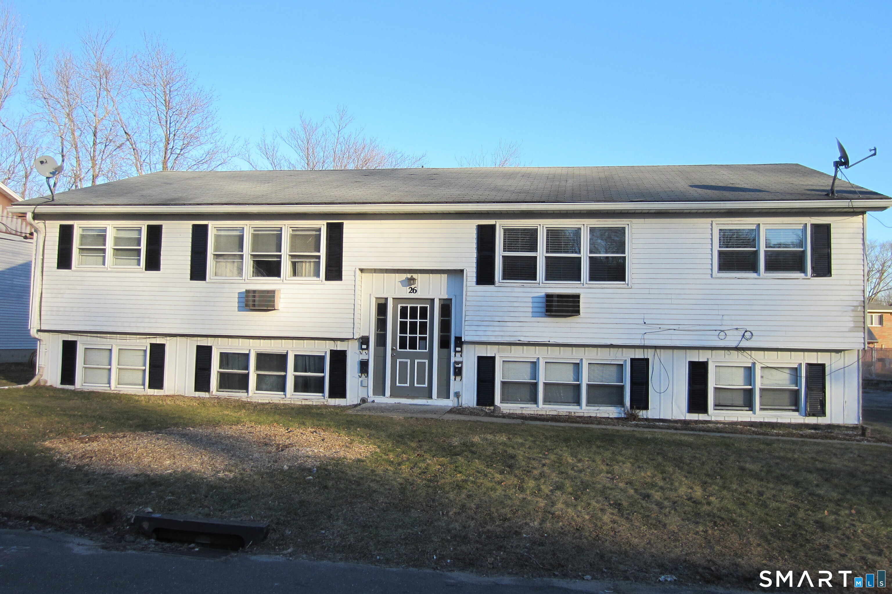 26 Elmview Circle, Unit 3 Waterbury, CT 06708 - Photo 1 of 1 a front view of a house with a yard