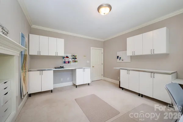 a kitchen with white cabinets