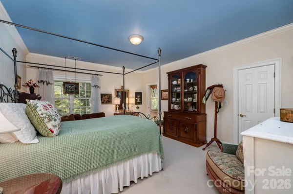 a bedroom with furniture and a window